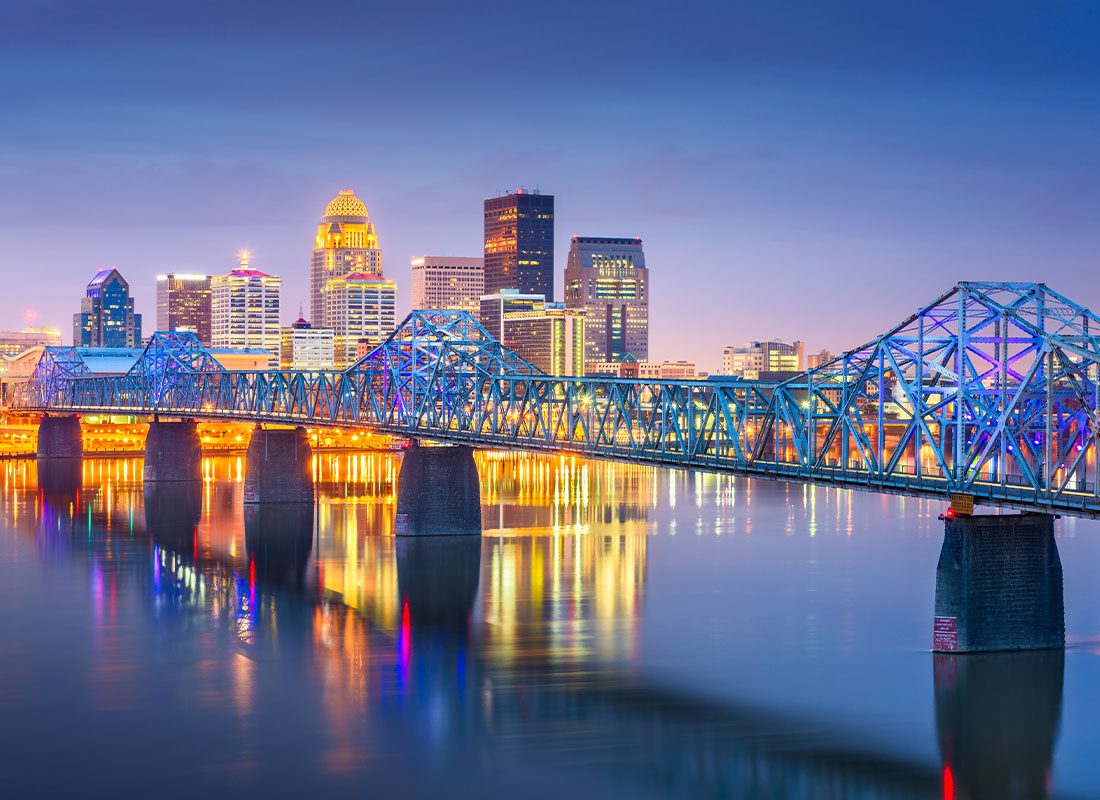 Louisville, KY - Louisville, Kentucky Skyline on the Ohio River at Dusk